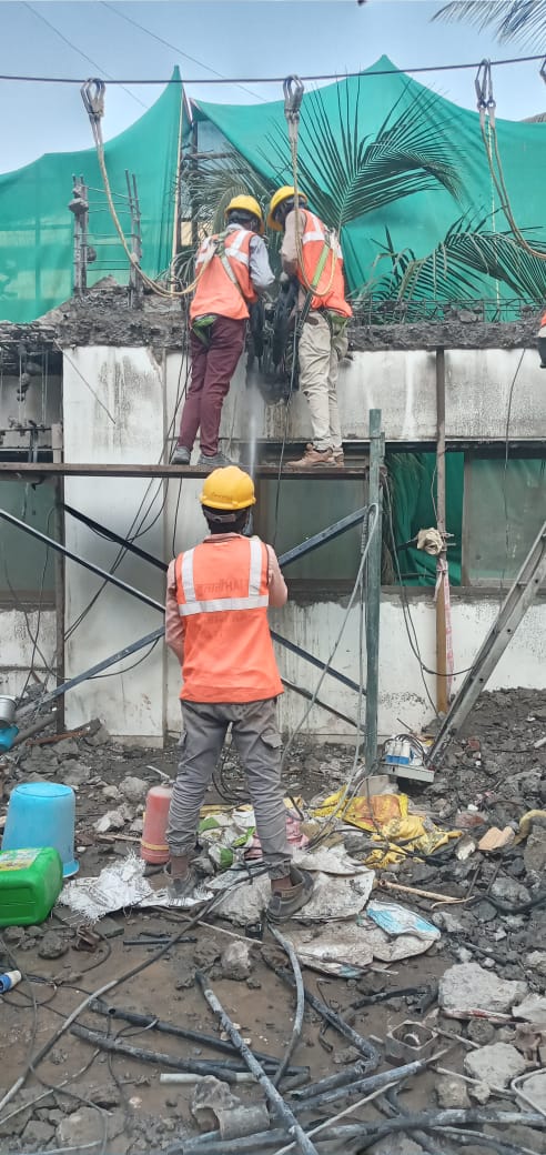 Manual concrete demolition using jack hammer by Star Construction